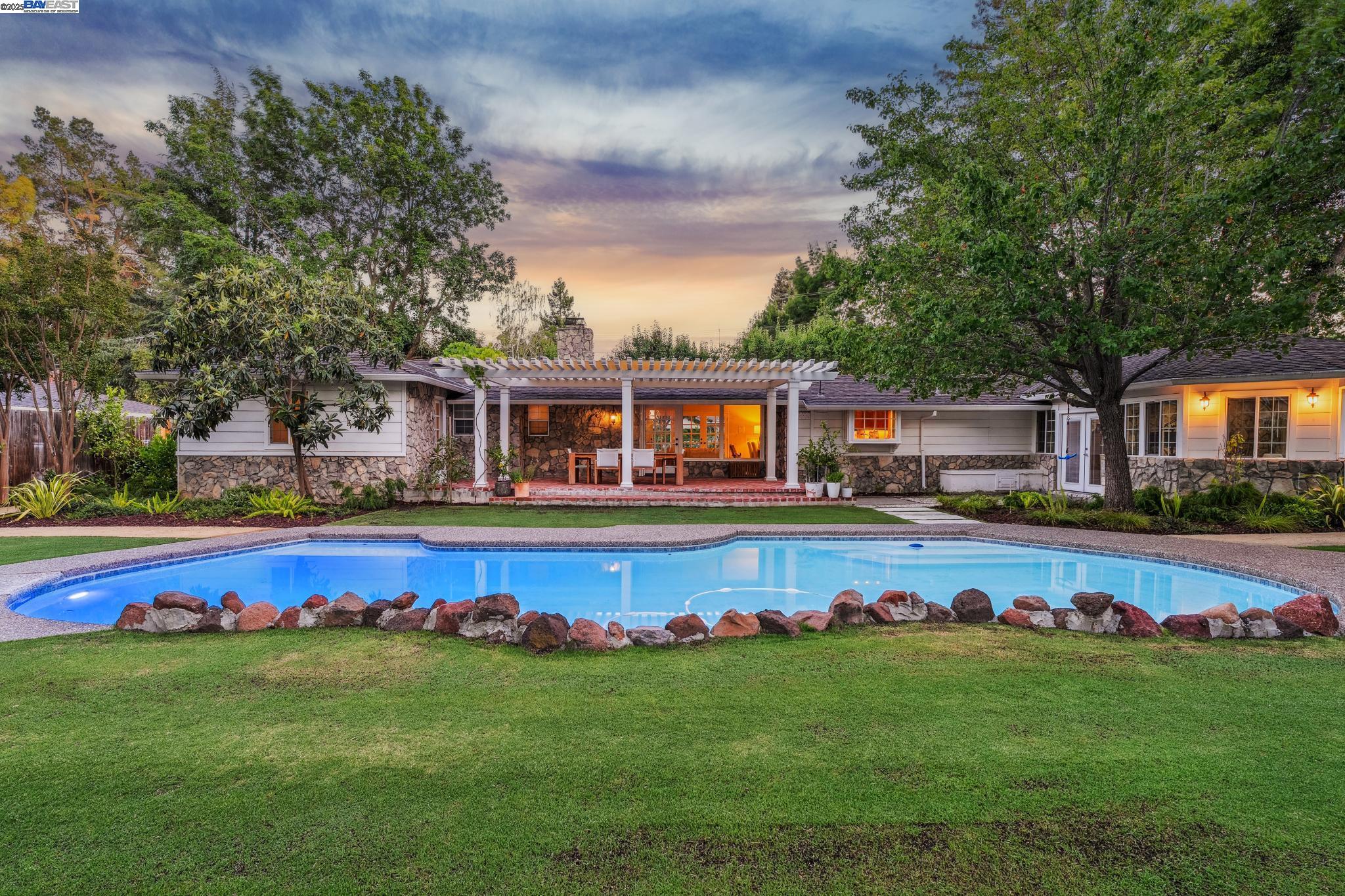 55 Cora Court Walnut Creek, CA 94597 - Photo 53 of 60 a front view of house with yard swimming pool and outdoor seating