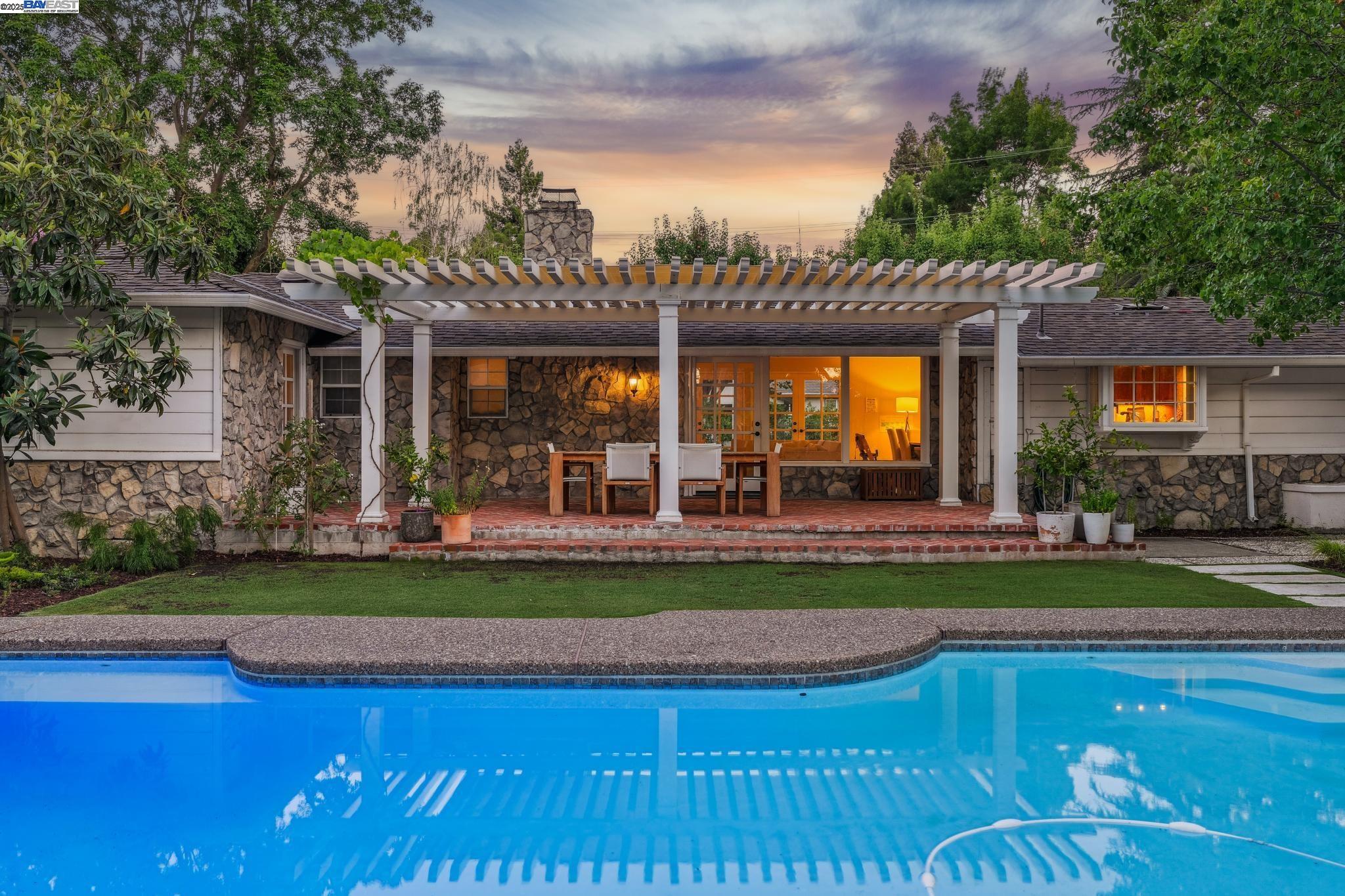 55 Cora Court Walnut Creek, CA 94597 - Photo 54 of 60 a view of a house with swimming pool and a yard
