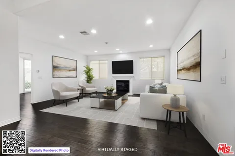 a living room with fireplace furniture and a flat screen tv