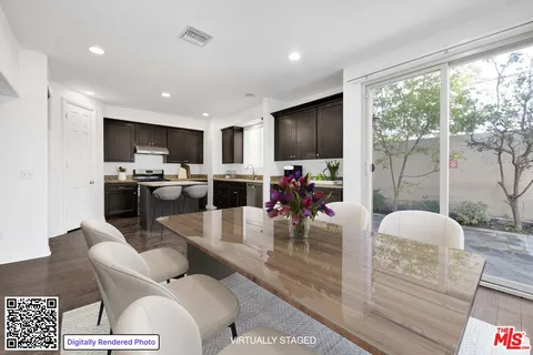 a living room with furniture a flat screen tv and a large window