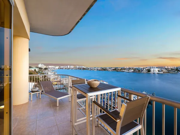 a view of a balcony with chairs