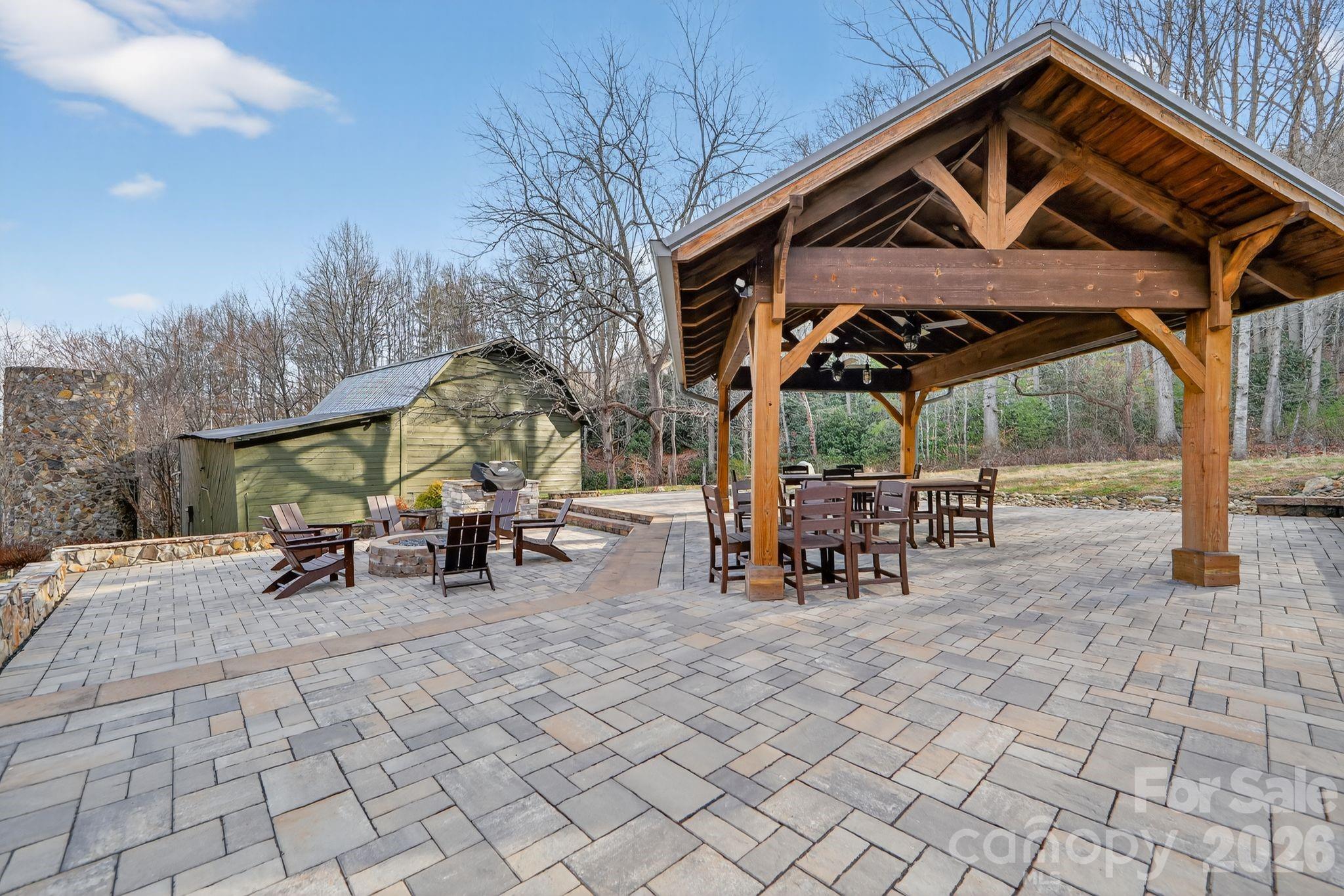 80 View Ridge Parkway Leicester, NC 28748 - Photo 14 of 15 a view of a chairs and table in the back yard of the house