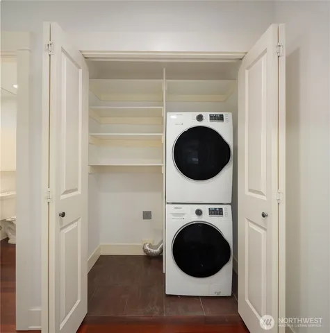 a view of a hallway with washer and dryer