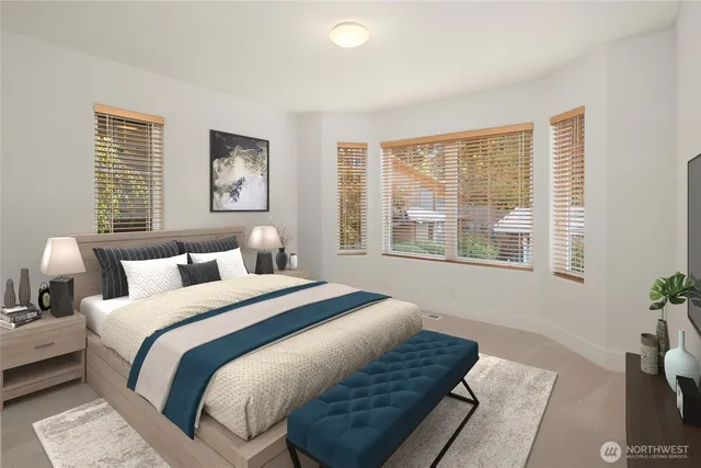 a bedroom with bed and a window