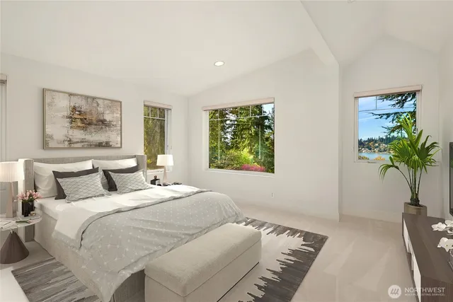 a bedroom with a large bed and a potted plant