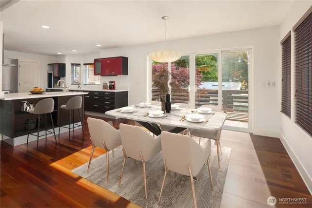 a view of a dining room with furniture window and wooden floor