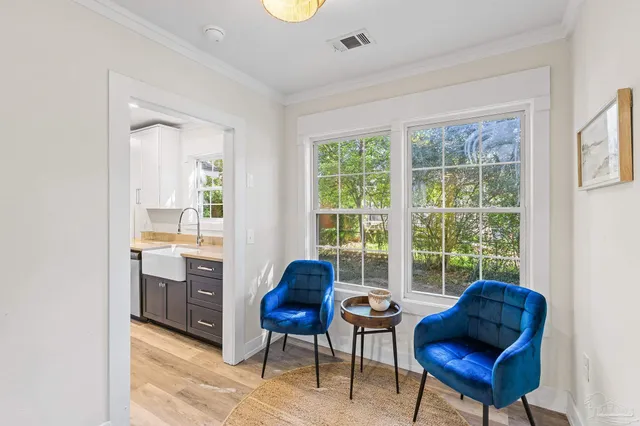 a living room with furniture and a window