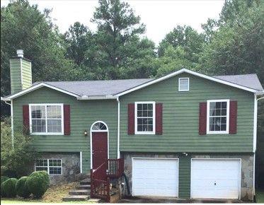 1330 To Lani Farm Road Stone Mountain, GA 30083 - Photo 1 of 1 a front view of a house with a yard