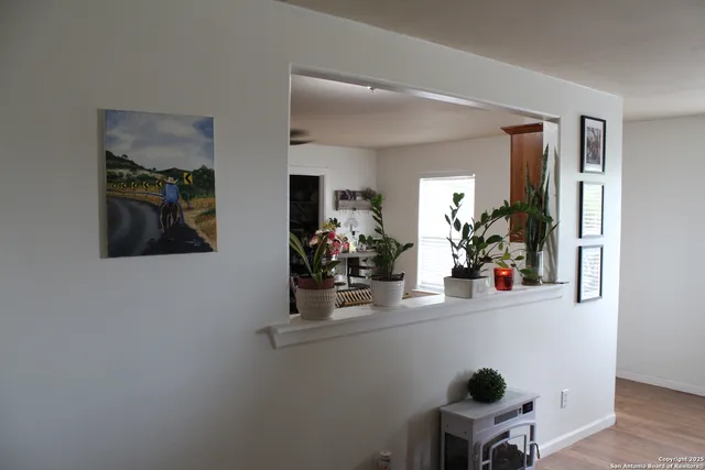 a room with a wooden floor and furniture