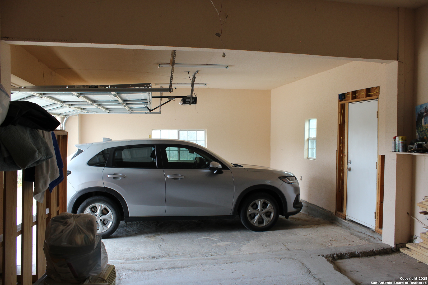 406 County Road 6850, Unit 1 Lytle, TX 78052 - Photo 3 of 24 a view of a car garage
