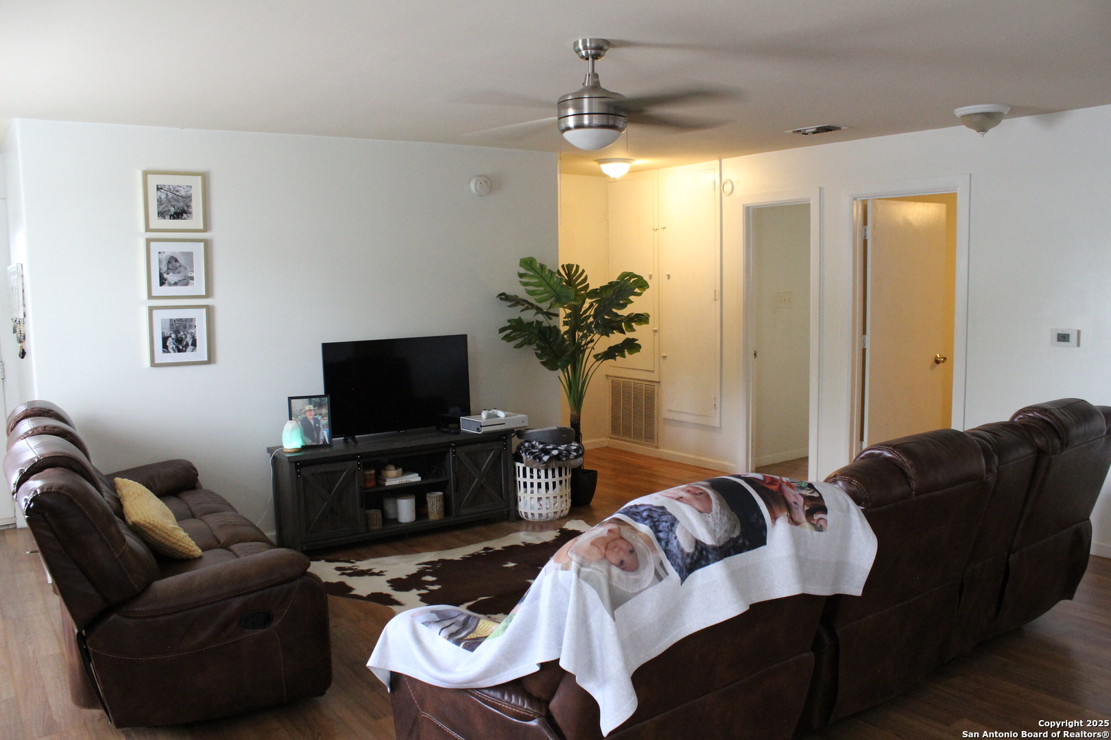 406 County Road 6850, Unit 1 Lytle, TX 78052 - Photo 9 of 24 a living room with furniture and a flat screen tv
