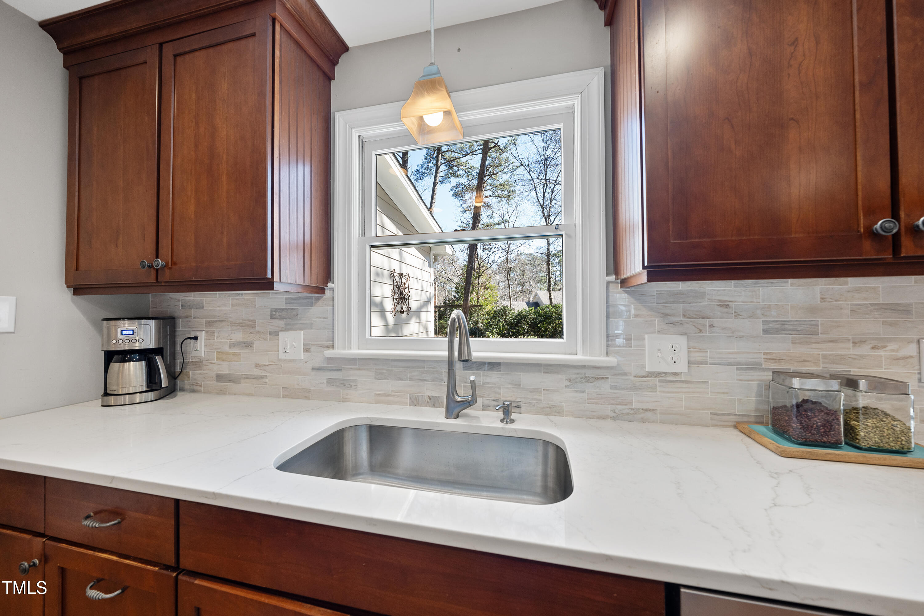 8616 Seagate Drive Raleigh, NC 27615 - Photo 12 of 56 a kitchen with a sink and a window