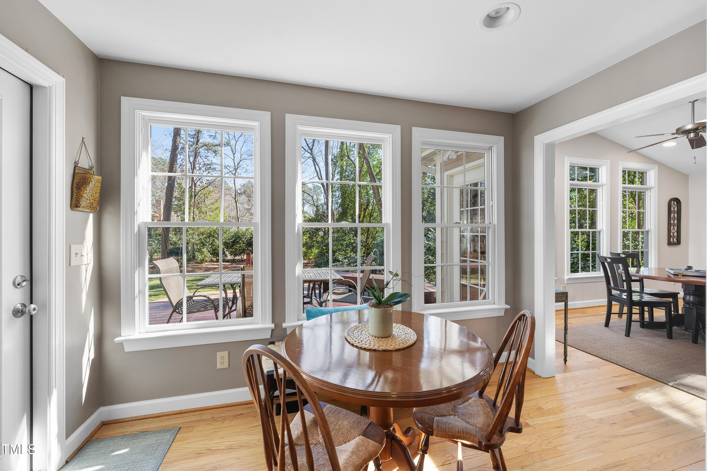 8616 Seagate Drive Raleigh, NC 27615 - Photo 14 of 56 a view of a dining room with furniture window and outside view