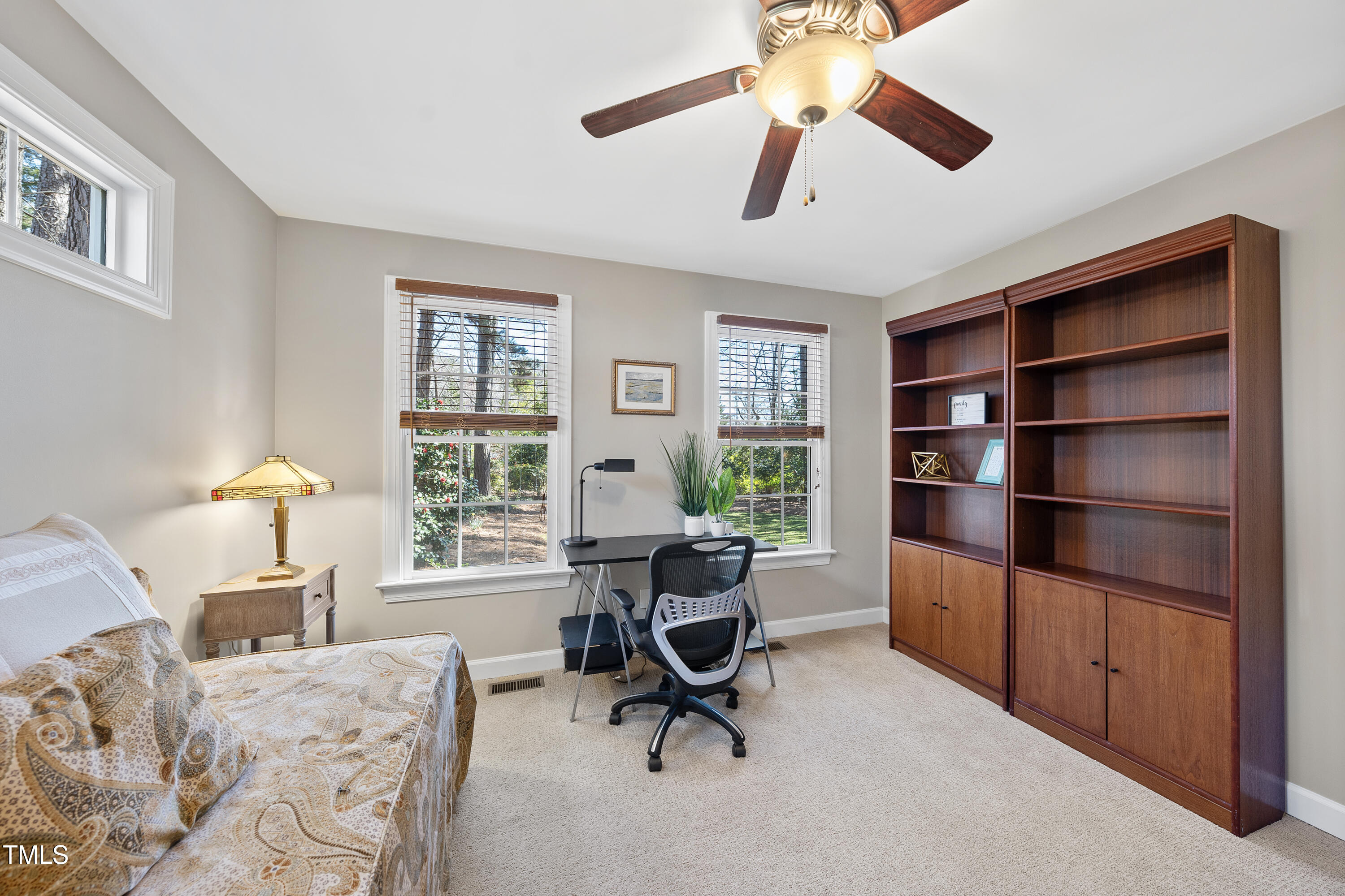 8616 Seagate Drive Raleigh, NC 27615 - Photo 25 of 56 a view of a livingroom with workspace and a window