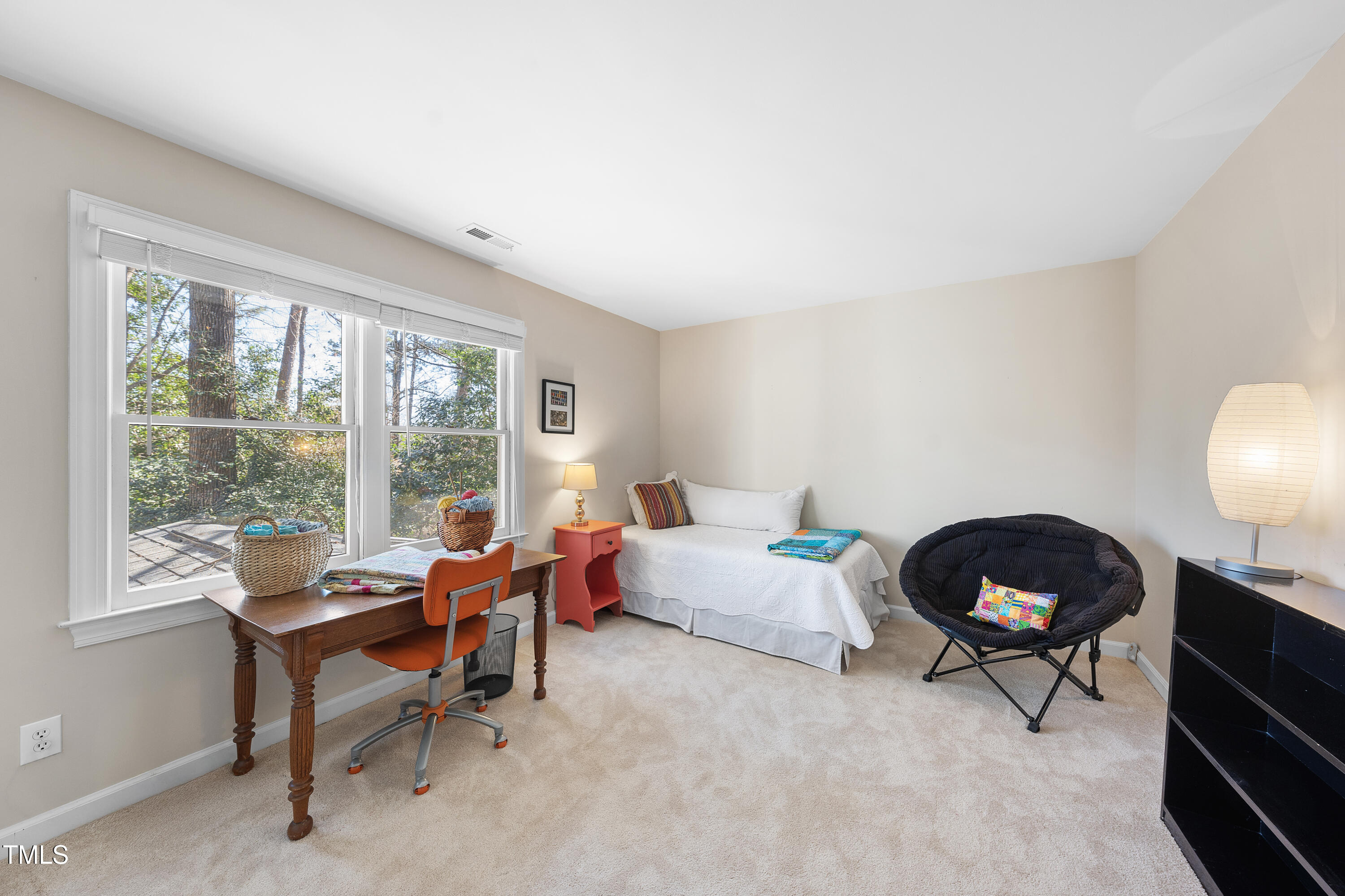 8616 Seagate Drive Raleigh, NC 27615 - Photo 39 of 56 a living room with furniture a rug and a large window