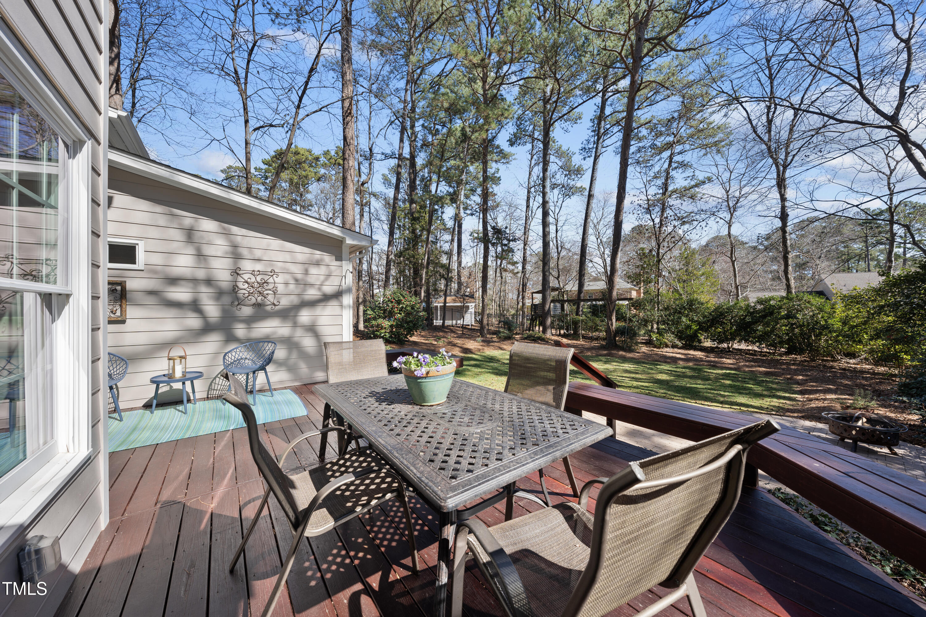8616 Seagate Drive Raleigh, NC 27615 - Photo 48 of 56 a view of a patio with table and chairs and potted plants