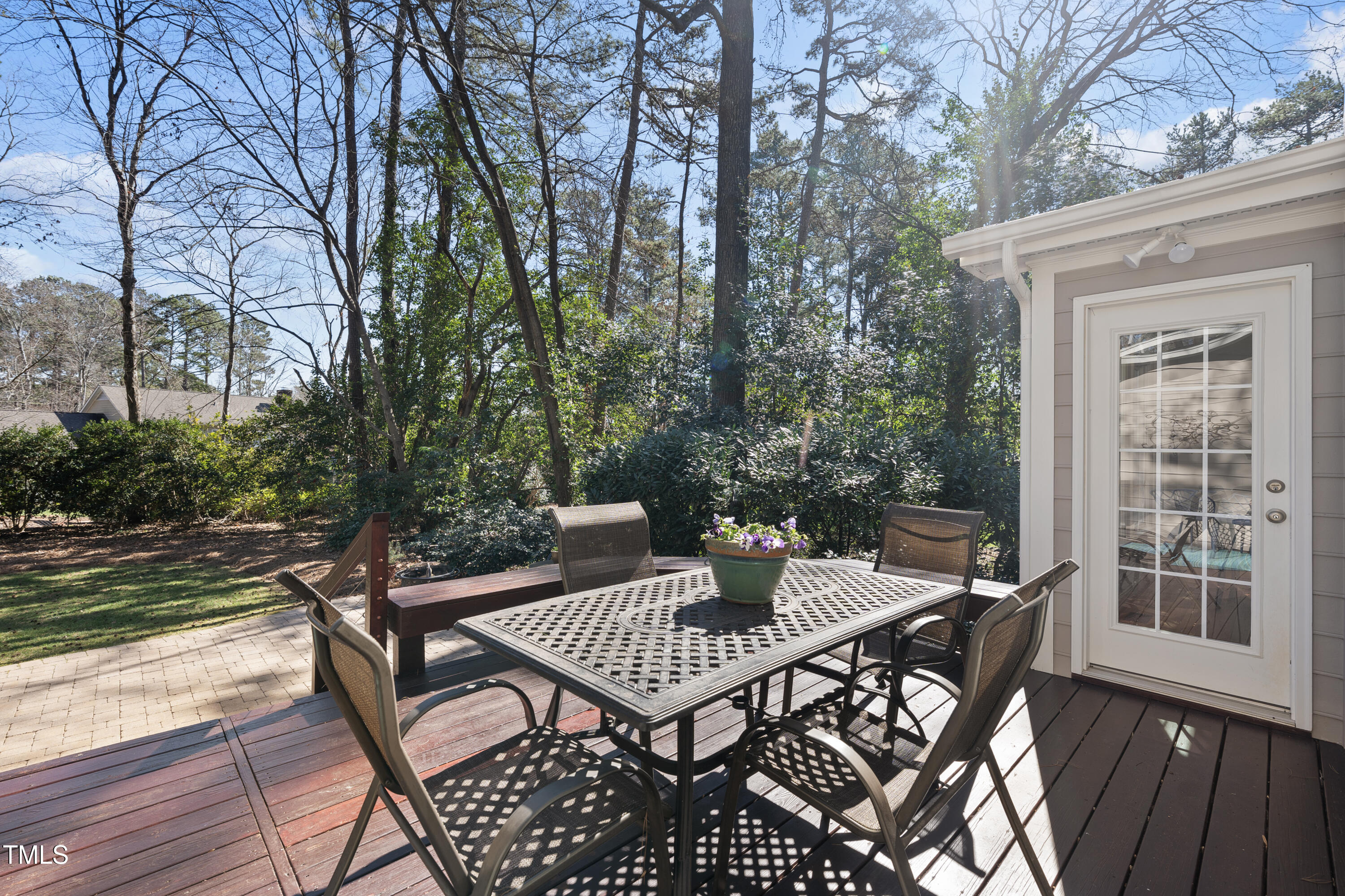 8616 Seagate Drive Raleigh, NC 27615 - Photo 5 of 56 a view of a patio with a table and chairs