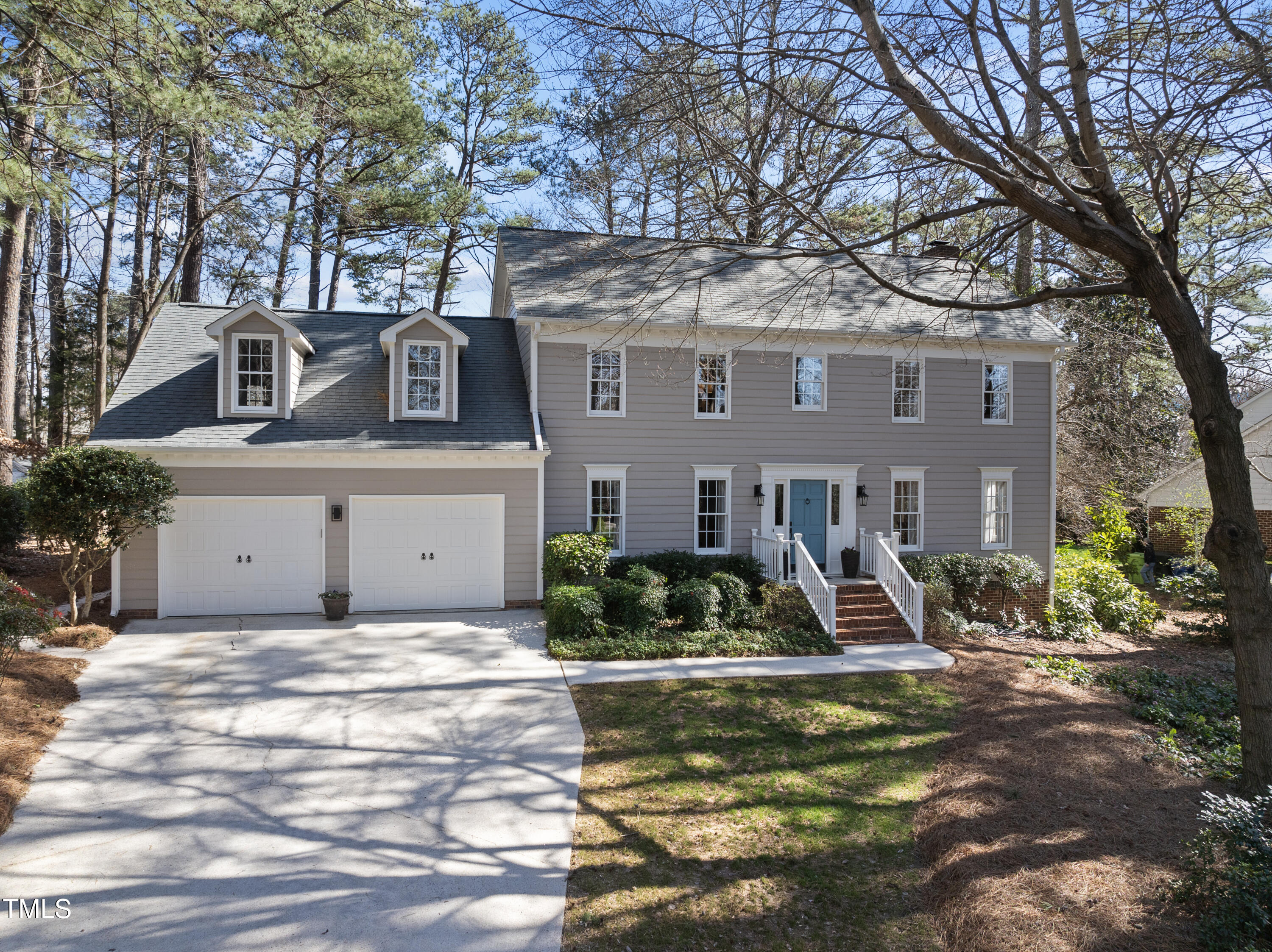 8616 Seagate Drive Raleigh, NC 27615 - Photo 54 of 56 a front view of a house with garden