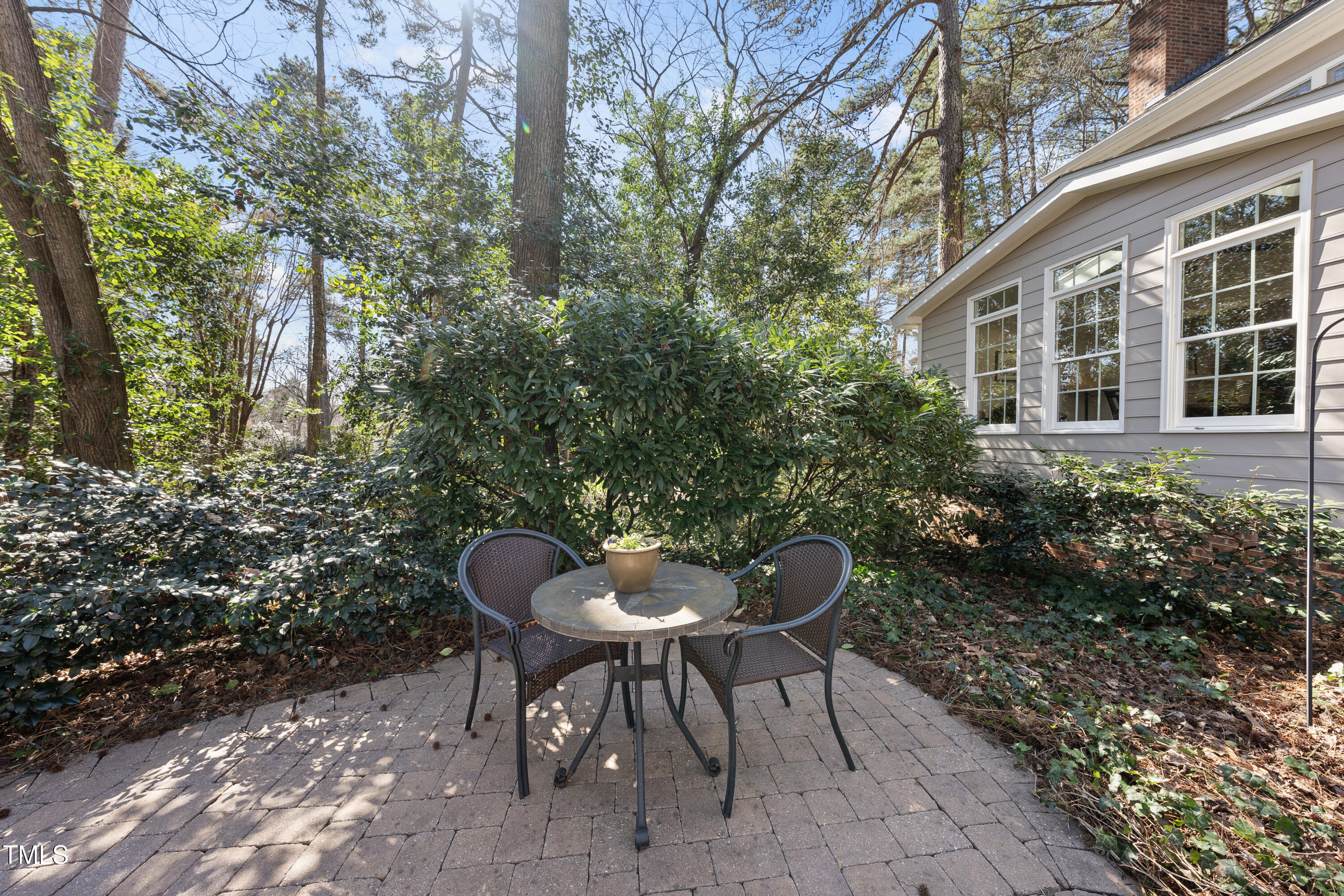 8616 Seagate Drive Raleigh, NC 27615 - Photo 6 of 56 a backyard of a house with table and chairs