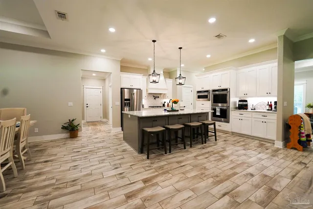 a kitchen with cabinets and appliances