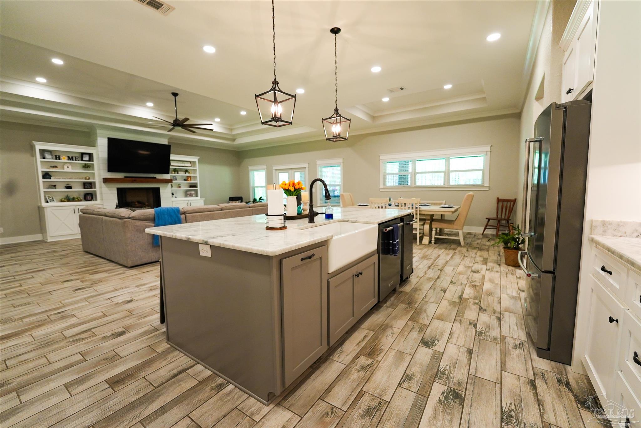 8410 Highway 97 Walnut Hill, FL 32568 - Photo 22 of 66 a large white kitchen with a large counter top appliances and cabinets