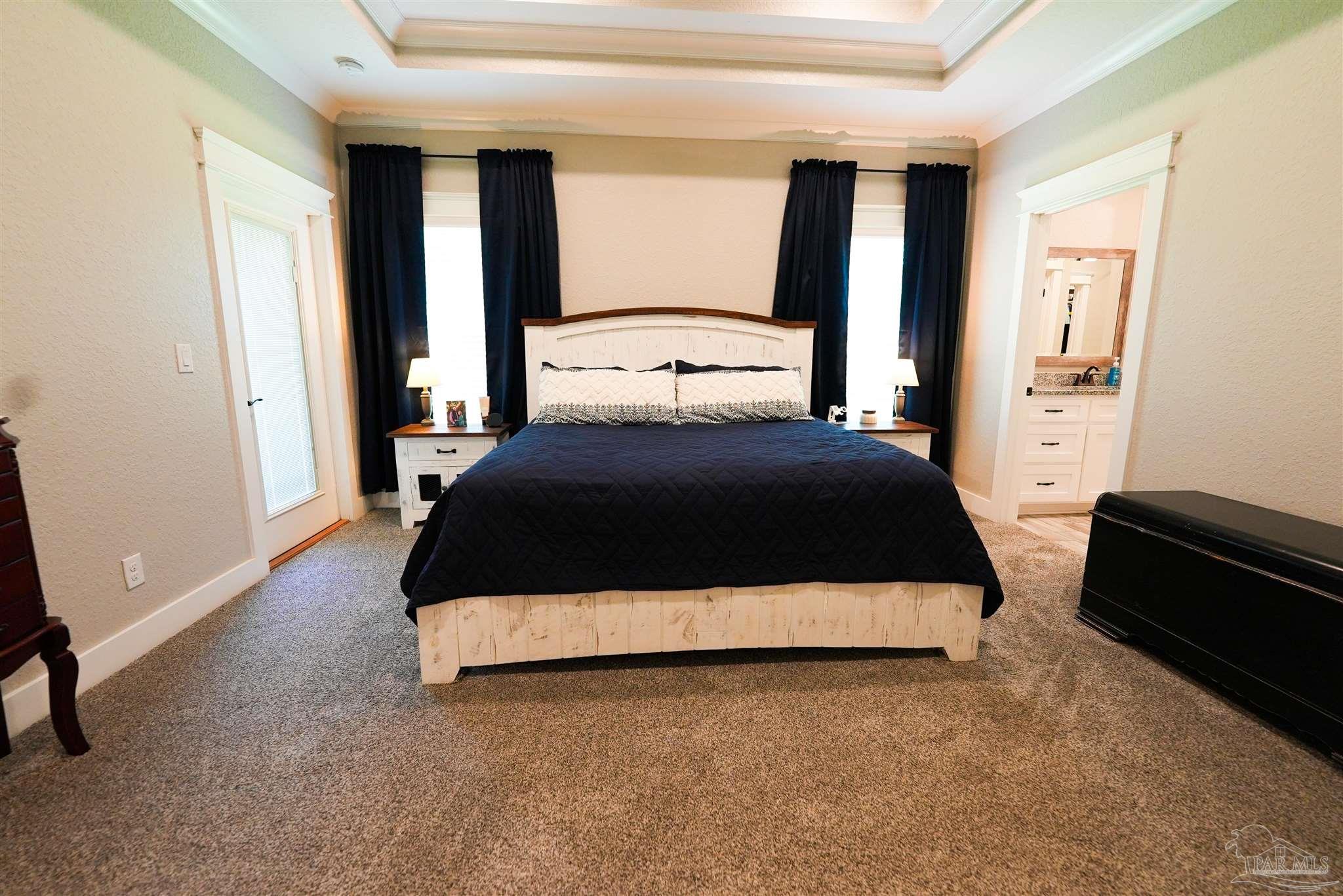 8410 Highway 97 Walnut Hill, FL 32568 - Photo 26 of 66 a bedroom with a bed lamp and a large window