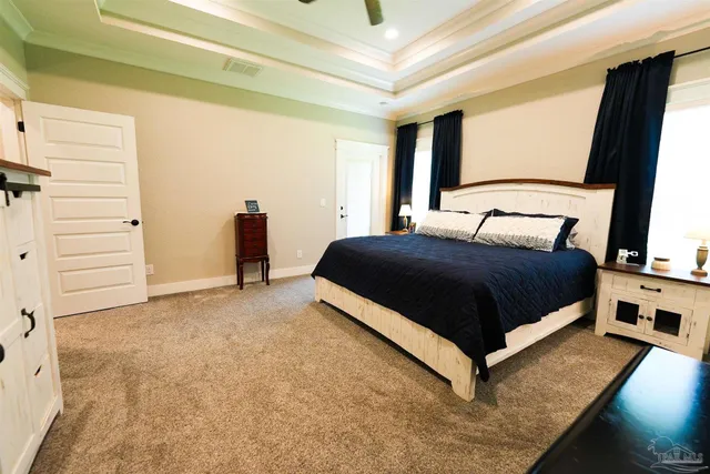 a view of a hallway with wooden floor and entryway