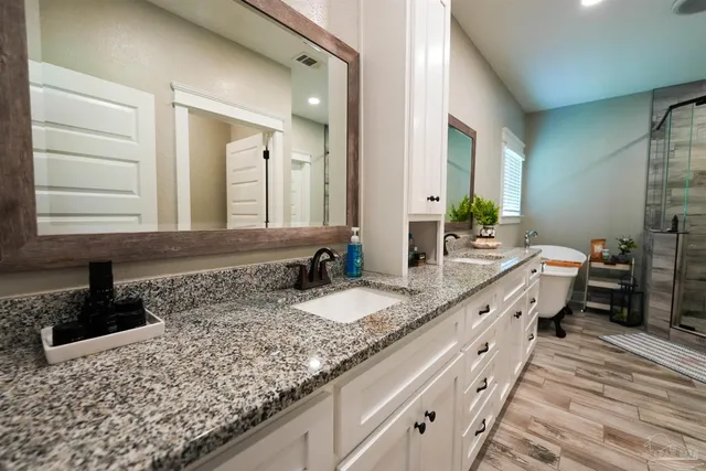 a utility room with sink dryer and washer