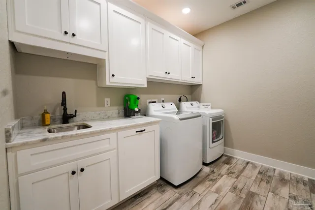 a bathroom with a granite countertop sink toilet and mirror