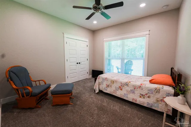 a front view of a house with outdoor seating