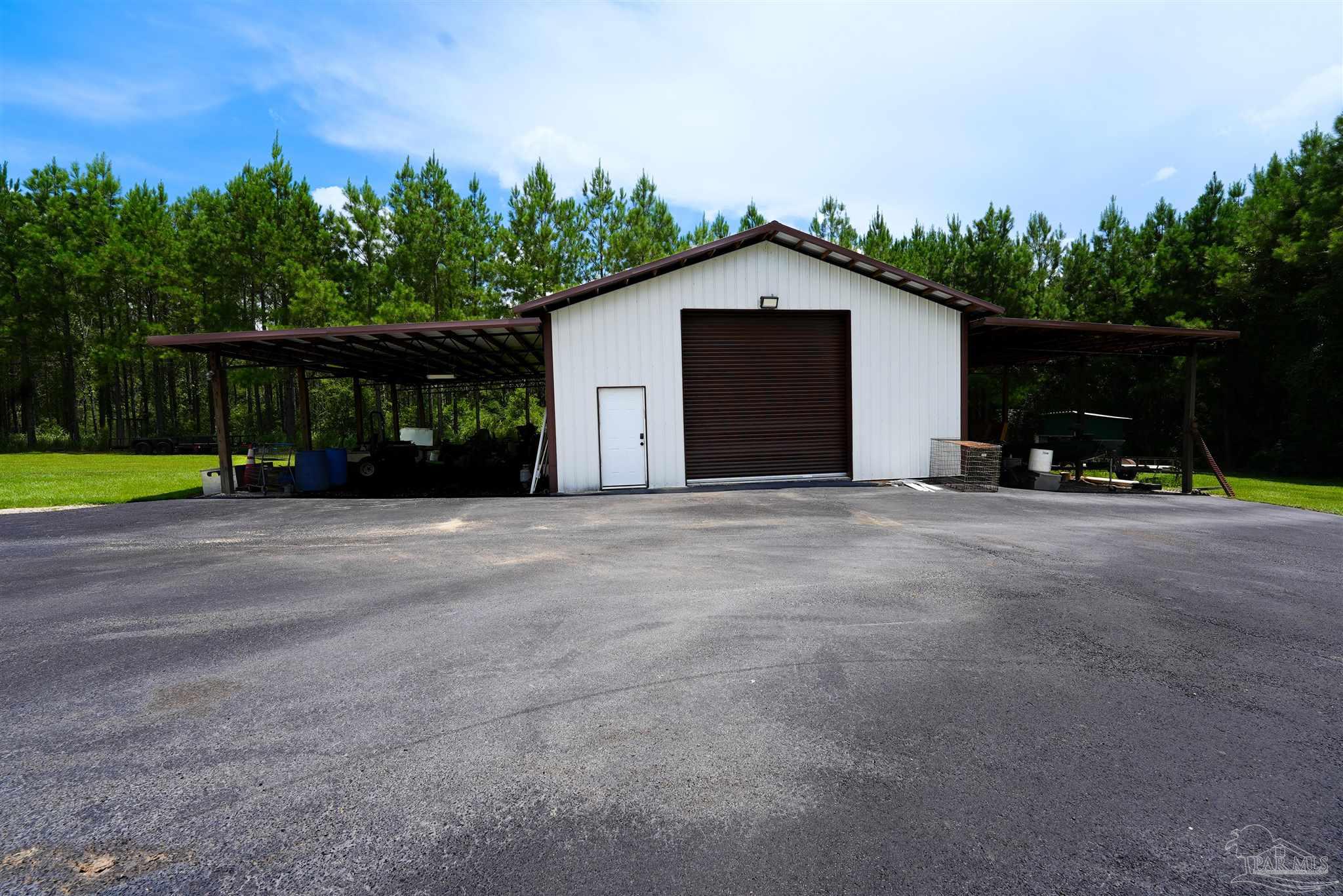8410 Highway 97 Walnut Hill, FL 32568 - Photo 61 of 66 a view of a house with a yard