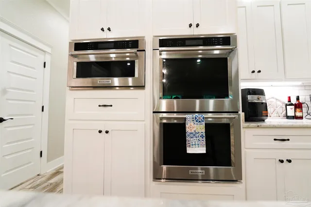 a kitchen with a stove and a cabinet