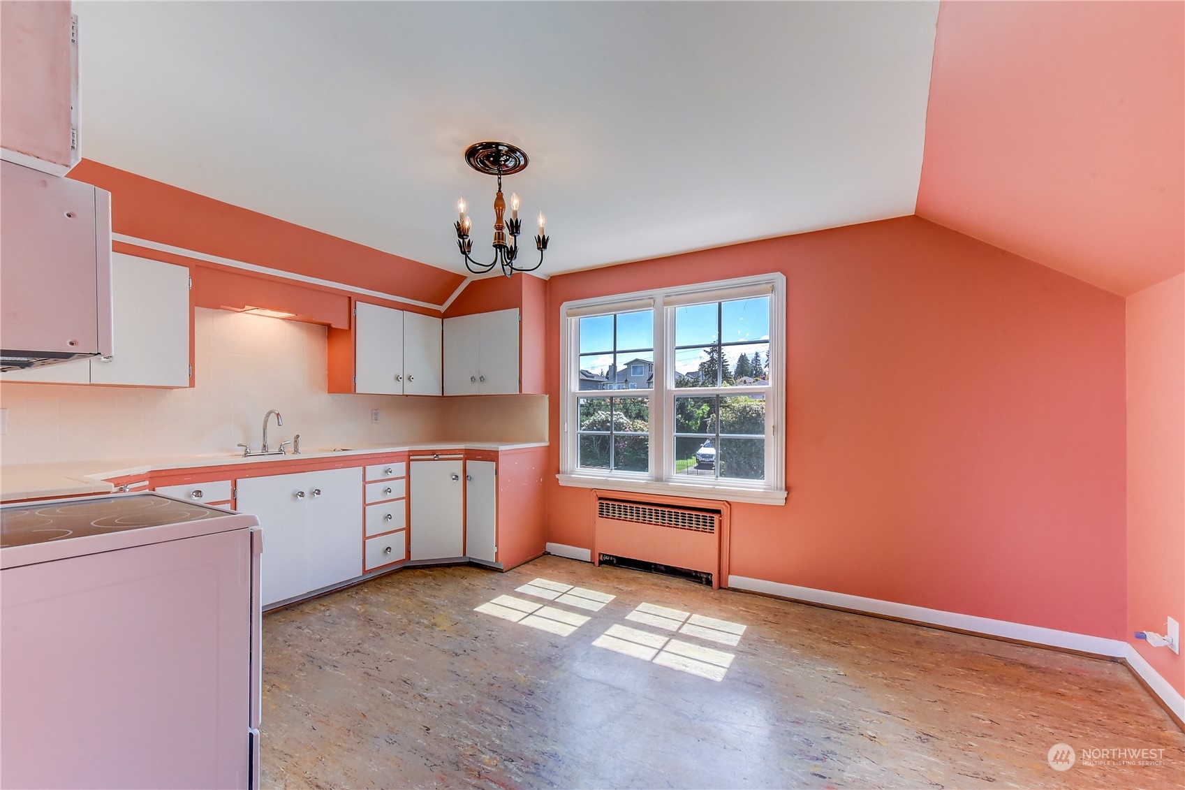2824 Northwest 93rd Street Seattle, WA 98117 - Photo 11 of 38 a view of a kitchen with a sink cabinets and window