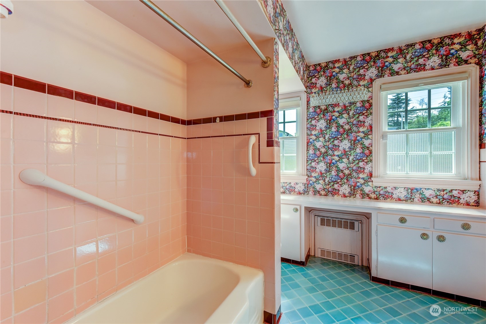 2824 Northwest 93rd Street Seattle, WA 98117 - Photo 17 of 38 a bathroom with a sink a mirror and a bathtub