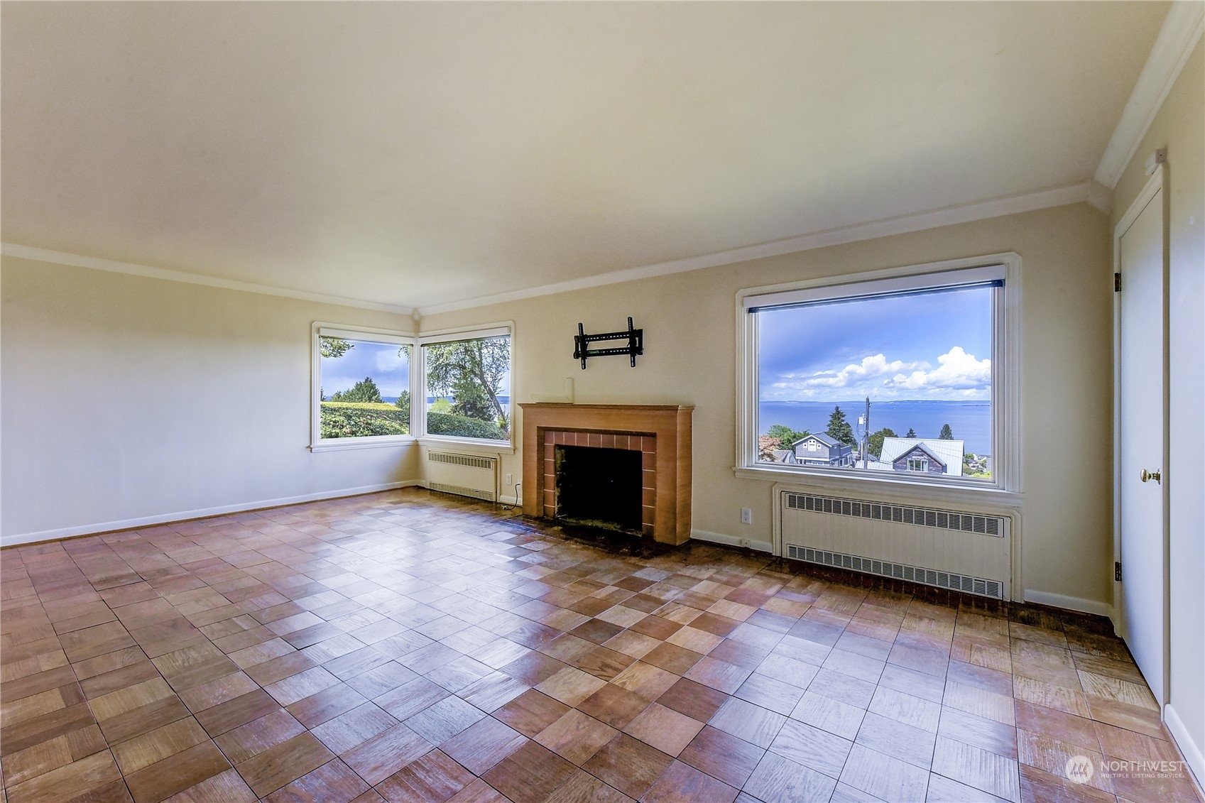2824 Northwest 93rd Street Seattle, WA 98117 - Photo 20 of 38 a view of empty room with fireplace and fan
