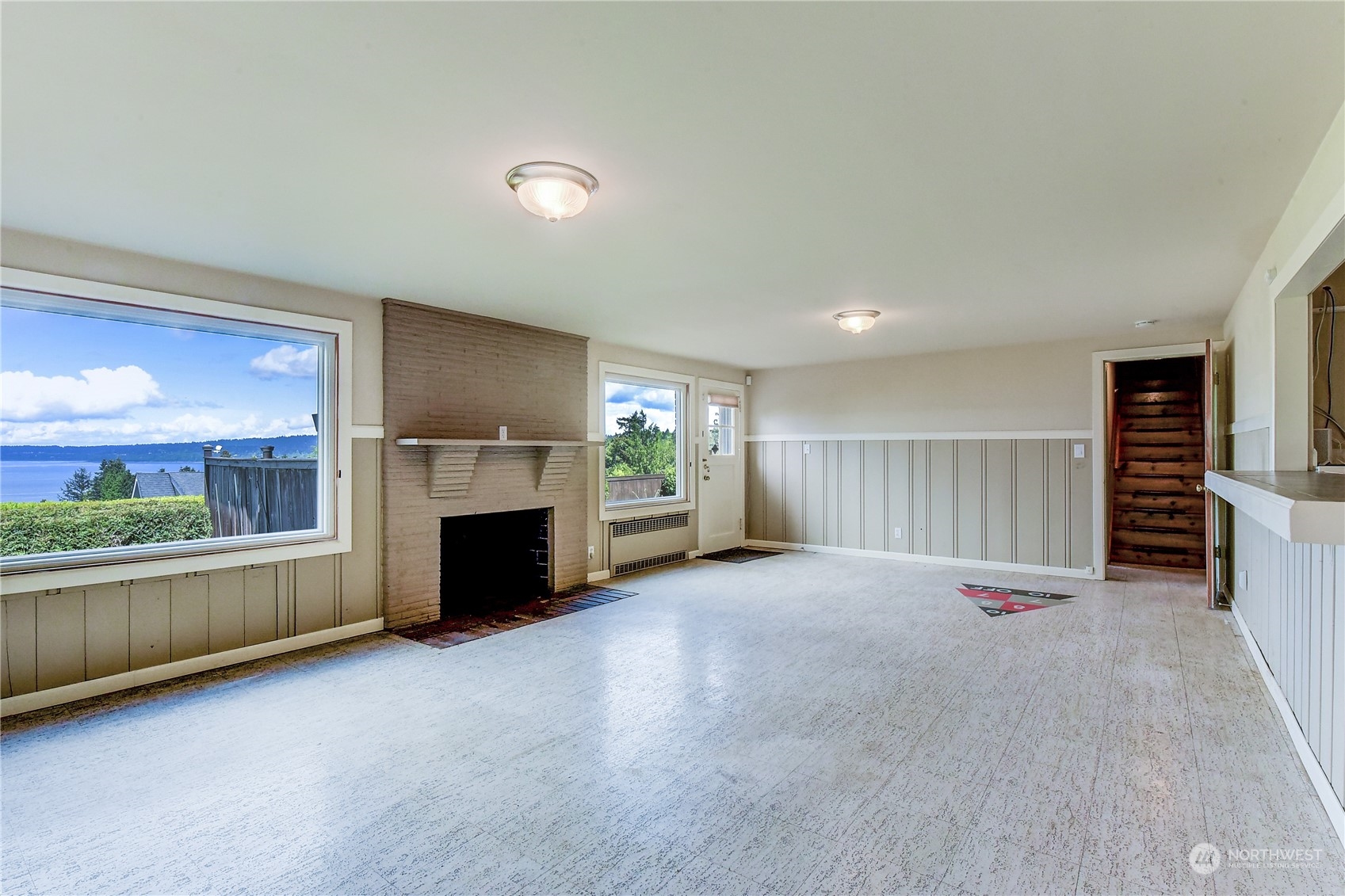 2824 Northwest 93rd Street Seattle, WA 98117 - Photo 23 of 38 an empty room with furniture and a fireplace
