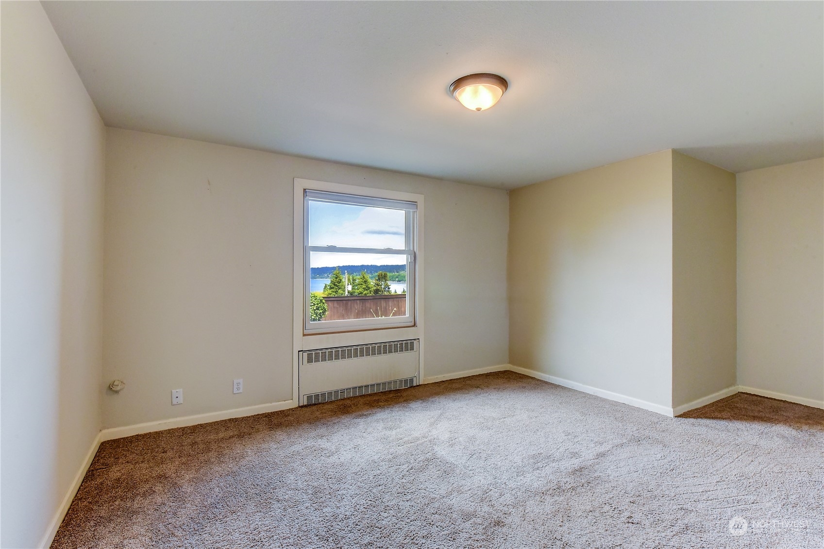 2824 Northwest 93rd Street Seattle, WA 98117 - Photo 24 of 38 an empty room with windows
