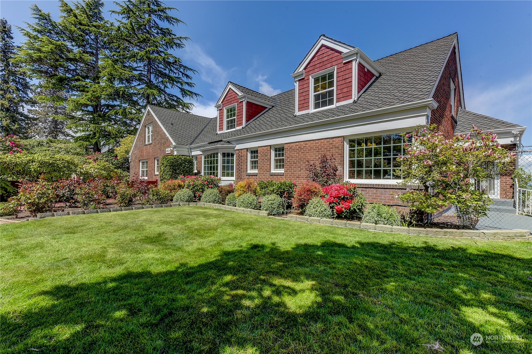 2824 Northwest 93rd Street Seattle, WA 98117 - Photo 27 of 38 a front view of house with yard and green space