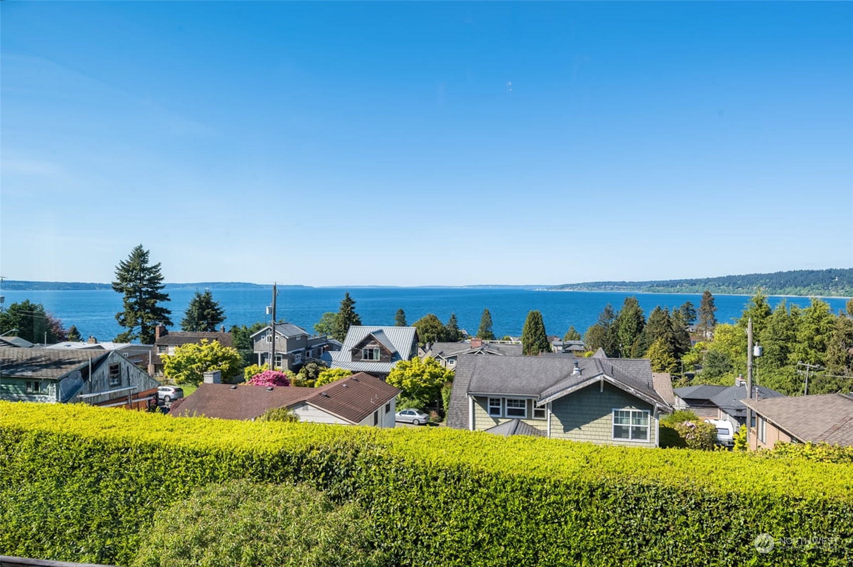 2824 Northwest 93rd Street Seattle, WA 98117 - Photo 36 of 38 a view of a house with lawn chairs and a table