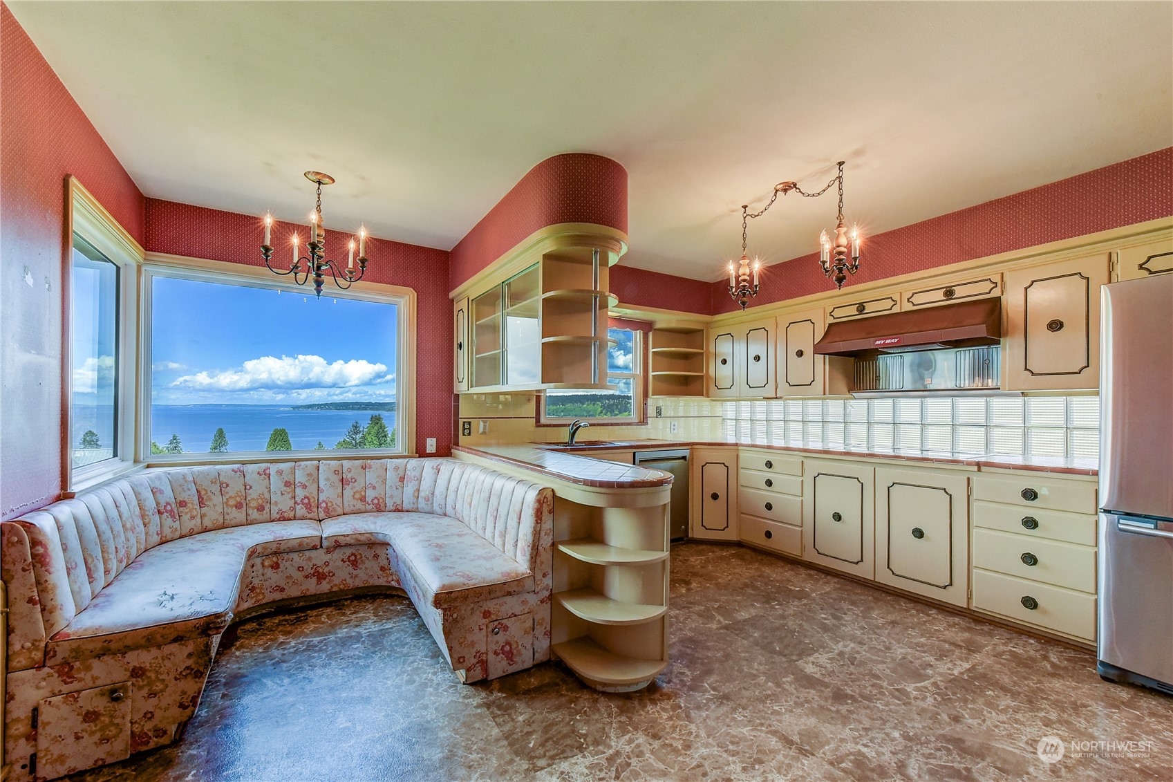 2824 Northwest 93rd Street Seattle, WA 98117 - Photo 5 of 38 a kitchen with cabinets and window