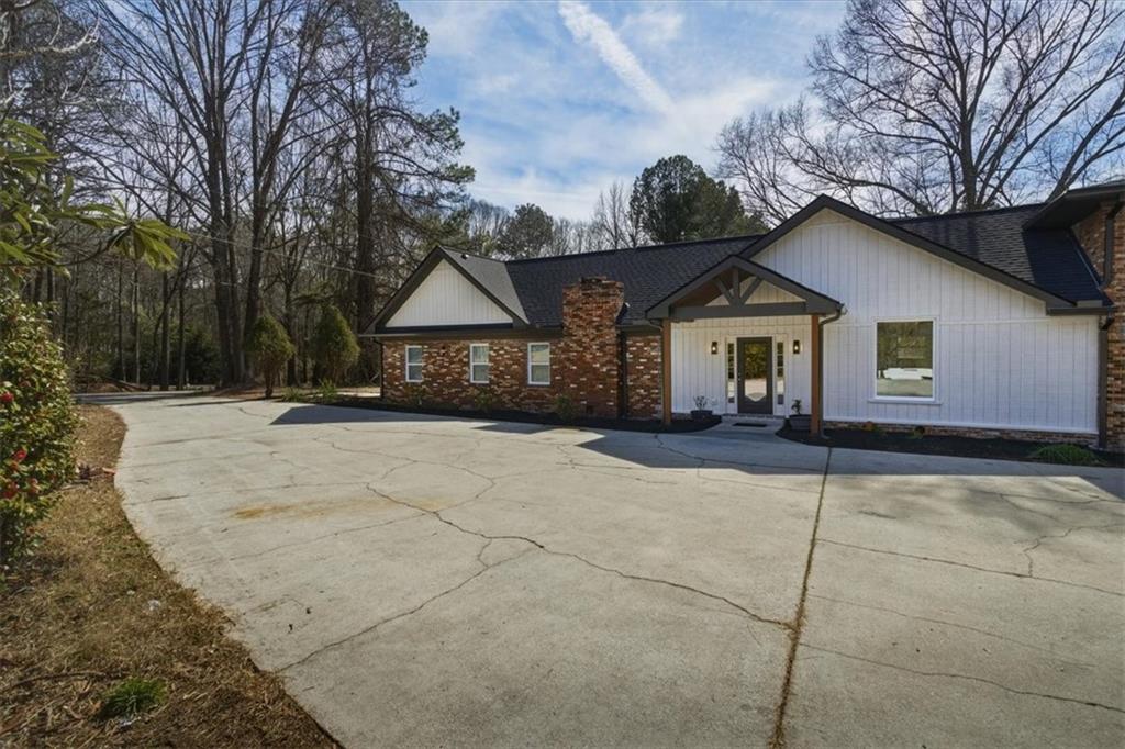 4911 Lower Jersey Road Oxford, GA 30054 - Photo 39 of 56 a view of house with yard and tree in front of it