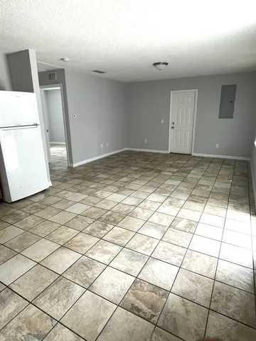 a view of a livingroom and window
