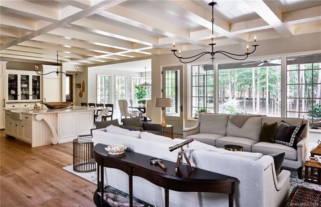 419 Bramble Way, Unit 7 Fort Mill, SC 29708 - Photo 12 of 40 a view of a dining room with furniture a chandelier and wooden floor