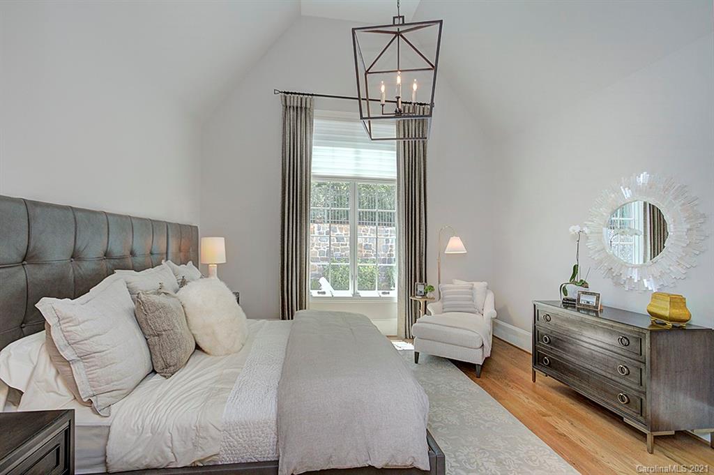 419 Bramble Way, Unit 7 Fort Mill, SC 29708 - Photo 21 of 40 a bedroom with a bed a couch and dresser