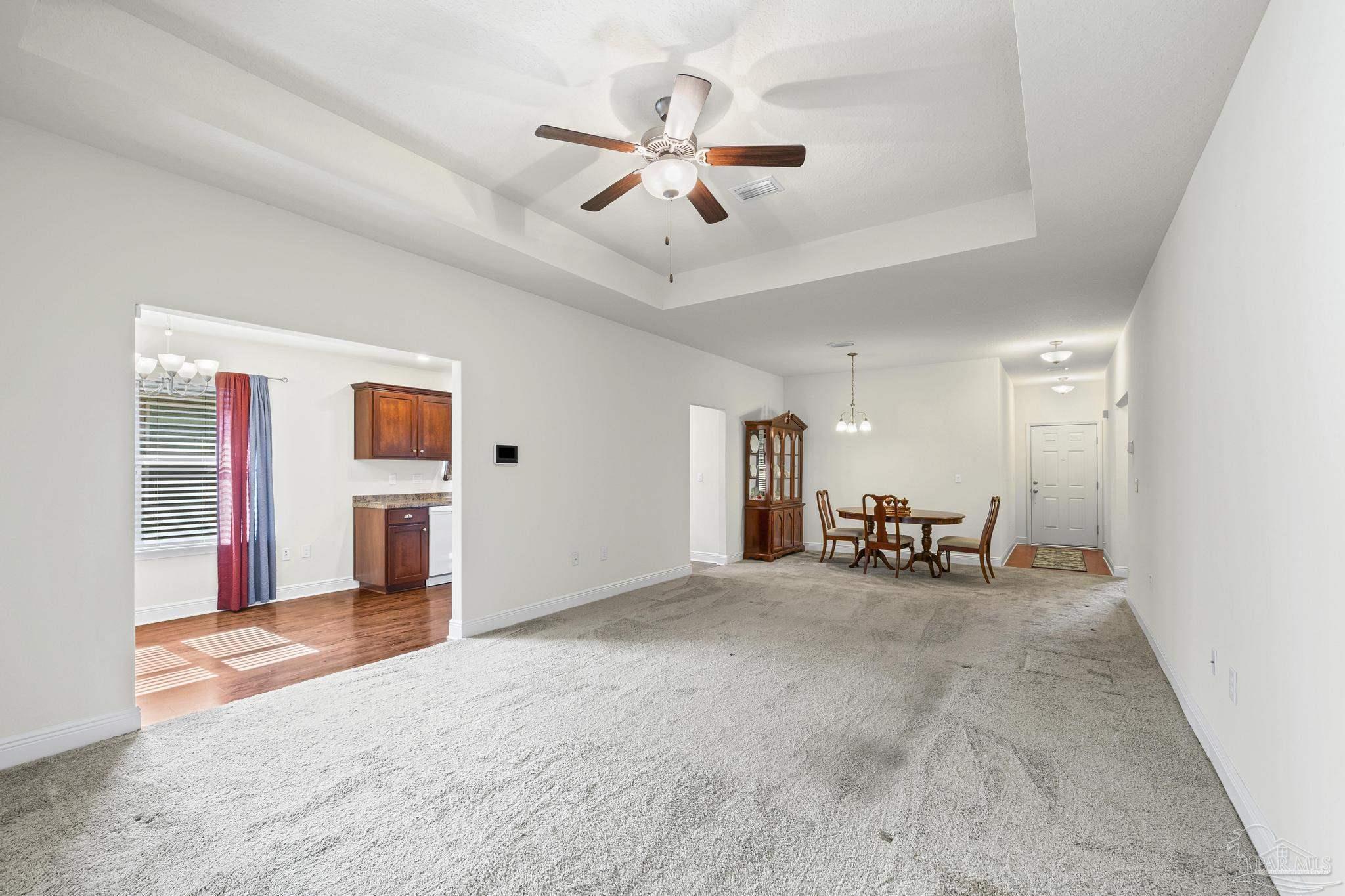 4442 Fiske Street Pace, FL 32571 - Photo 15 of 44 an empty room with furniture and windows