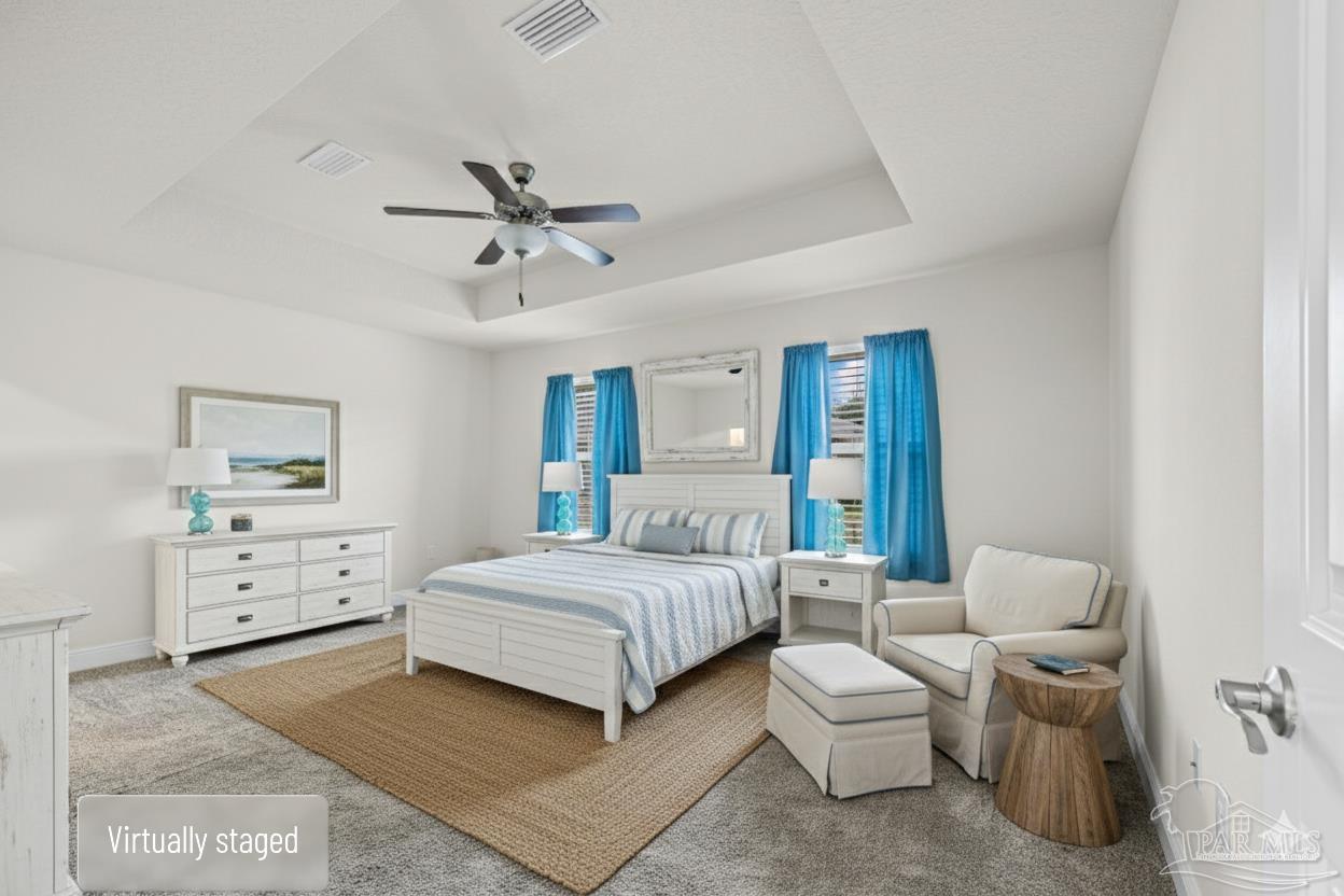 4442 Fiske Street Pace, FL 32571 - Photo 27 of 44 a bedroom with a bed and ceiling fan