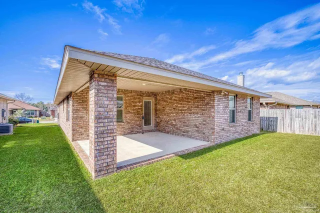 a view of a backyard of the house