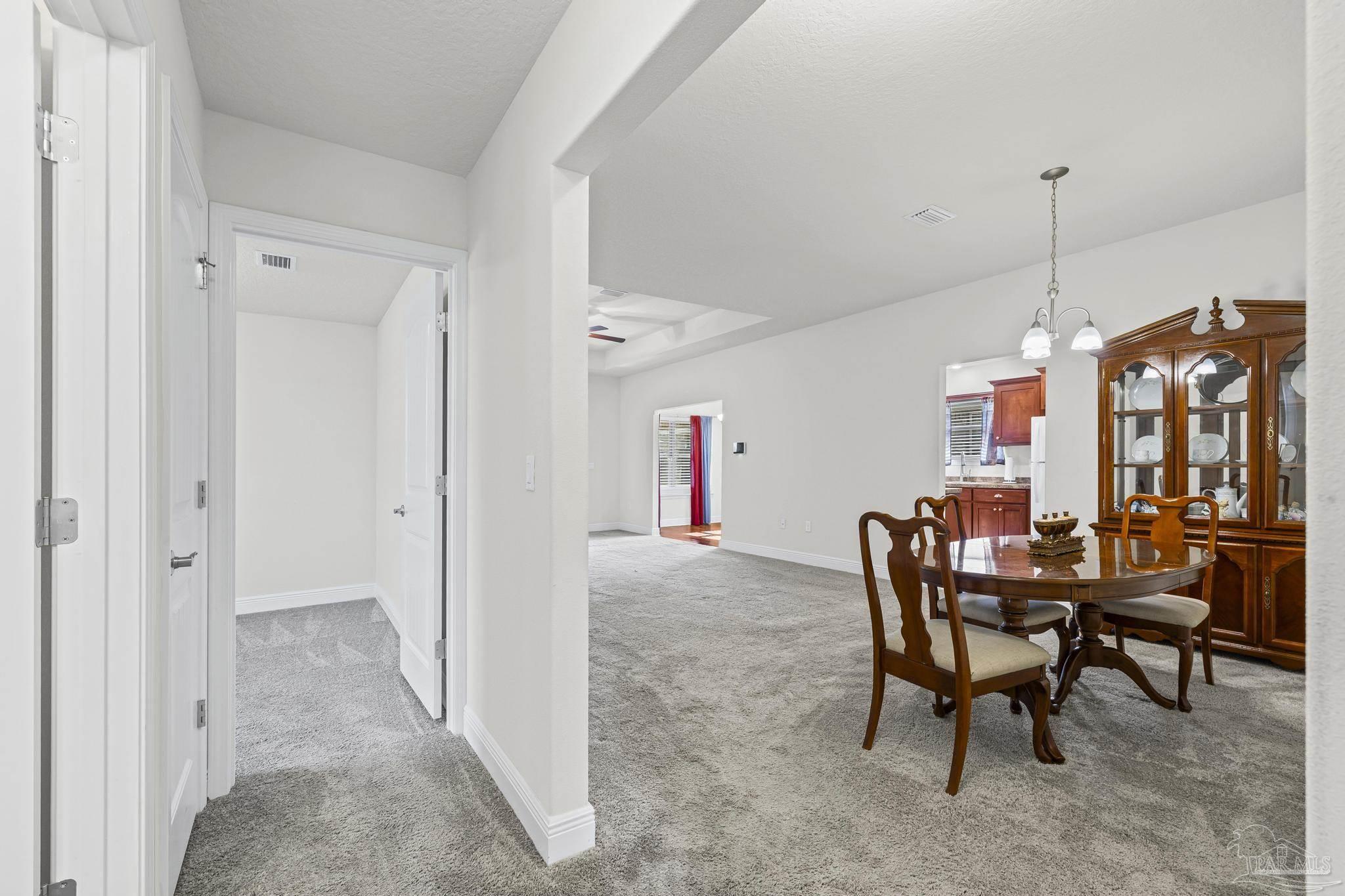 4442 Fiske Street Pace, FL 32571 - Photo 32 of 44 a view of a dining room with furniture