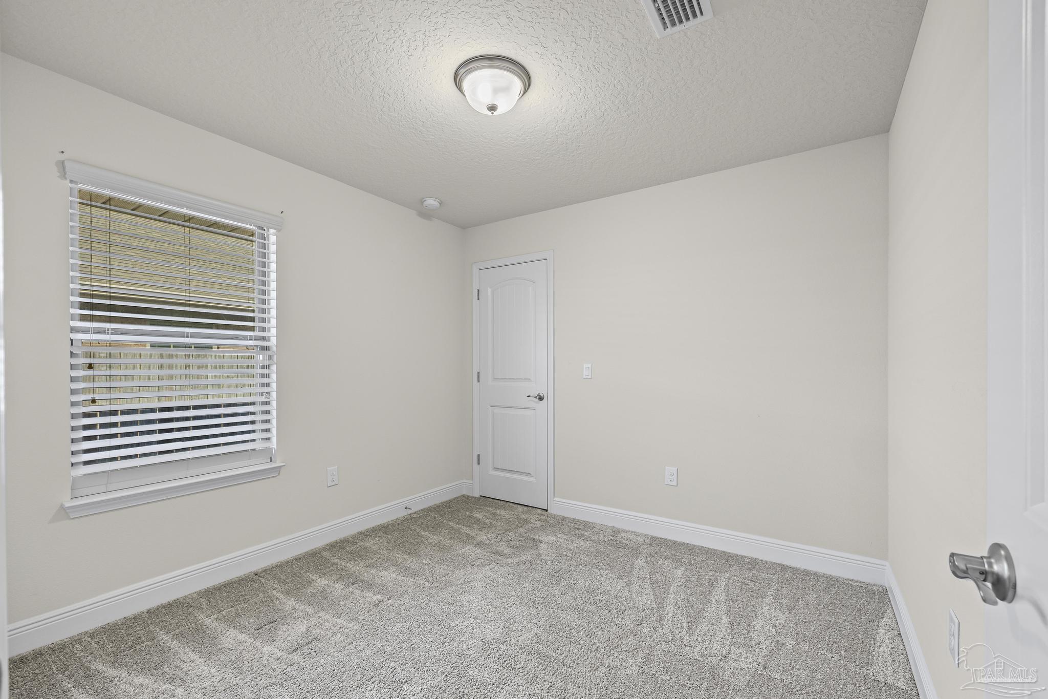 4442 Fiske Street Pace, FL 32571 - Photo 35 of 44 a view of empty room with windows