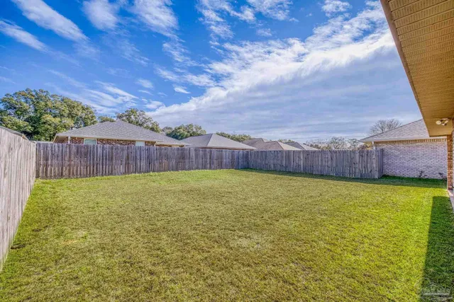 a swimming pool with wooden fence